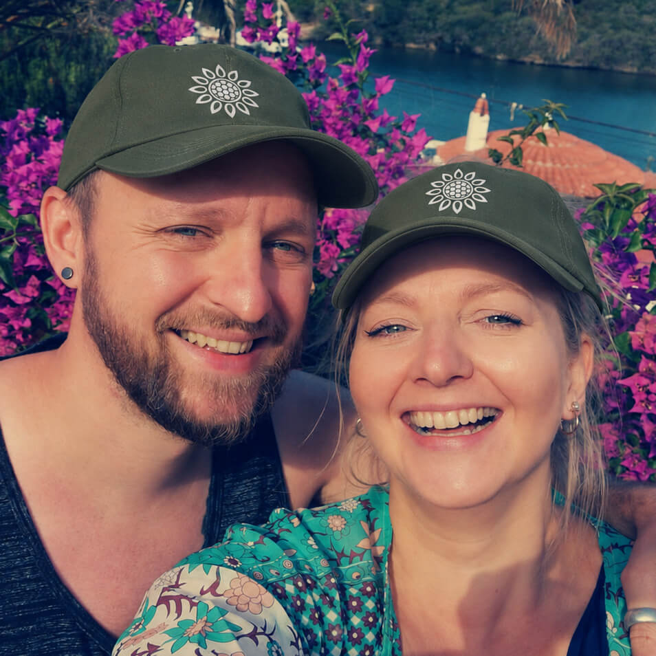 Doug and Gem, local gardeners in Ely, wearing Good Garden Folk caps